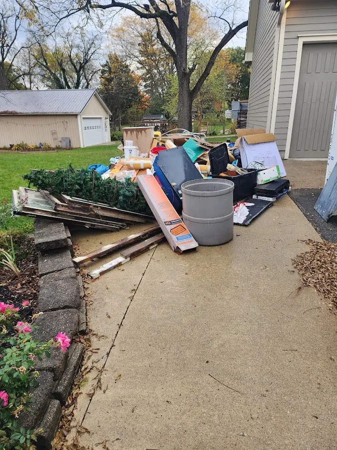 Dumpster being loaded with debris for 10 Yard Dumpster Rental in Shady Hollow